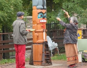 First Nations people rededicating the totem pole